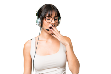 Telemarketer caucasian woman working with a headset over isolated background yawning and covering wide open mouth with hand