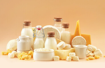 Colorful mix of dairy products varieties: milk and cheese, butter and mozzarella, yogurt and camembert. Food ingredients background