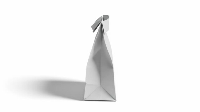 A simple, creased gray paper bag stands upright, casting a soft shadow