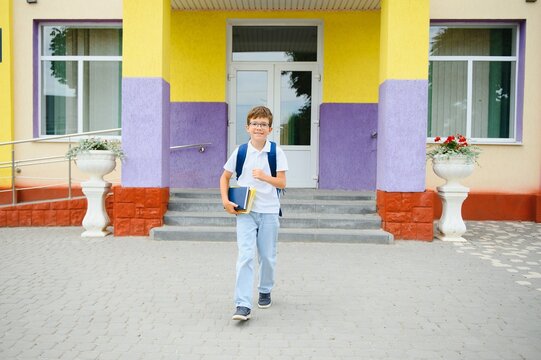 schoolboy runs out of school