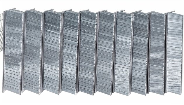 Silver Metal Staples in a Row, Isolated on White Background
