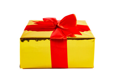 Golden gift box with red bow isolated on white background.