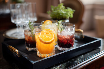 Cocktail Delight: An elegant display of finely crafted cocktails, garnished with vibrant citrus and fresh herbs, served on a stylish tray. A sensory experience for any occasion.