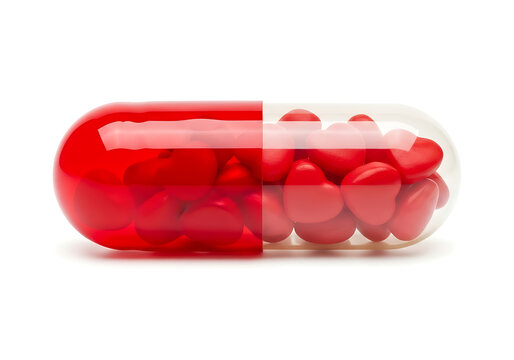 Red heart shaped pills inside a clear and red capsule