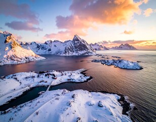 Aerial view of snow-covered mountain range and islands with village huts next to the ocean under a pastel sunset
