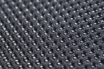 Close-up sample fabric. Black mesh texture. Soft and breathable used for industrial work.