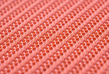 Close-up sample fabric. Pink mesh texture. Soft and breathable used for industrial work.