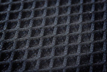 Close-up sample fabric. Black mesh texture. Soft and breathable used for industrial work.