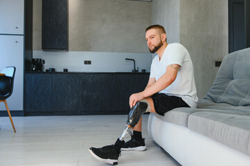 portrait of man with prosthetic leg sitting