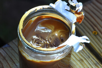 Chocolate filling cream, jar close-up view from above, close-up.