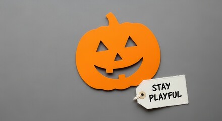 Smiling Orange Pumpkin with Tag on Gray Background