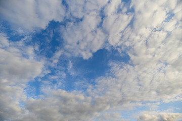 Experience the beauty of a Blue Sky adorned with Fluffy Clouds, bringing Natural Serenity