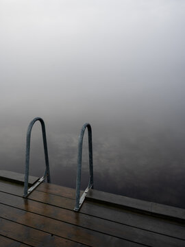Bathing ladder a misty gray day in Karlskoga Sweden