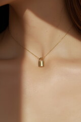 Elegant Gold Padlock Pendant Necklace on a Woman's Neck