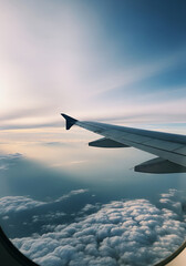 Dramatic Sky and Fluffy Clouds Seen from Airplane Window during Sunset