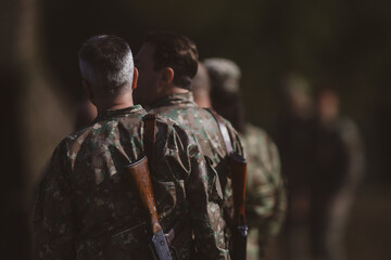 Romanian reservists take part at a drill where they train to shoot weapons