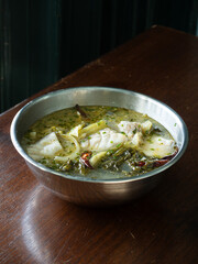 Pickled mustard green soup with sea bass fish