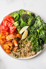 Healthy vegan Buddha bowl with quinoa, pumpkin and seasonal vegetables. Vegetable recipes.