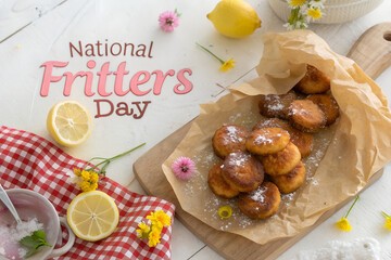 Celebrate National Fritters Day with golden treats, powdered sugar, and cozy vibes. A cheerful flat lay of fritters, lemon, flowers, and festive kitchen flair. generative ai