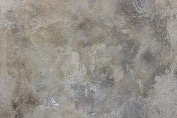 Weathered outdoor grey plaster wall with rough flat texture.