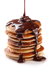 Obraz premium Stack of Pancakes with Dripping Melted Chocolate Syrup Isolated on White Background