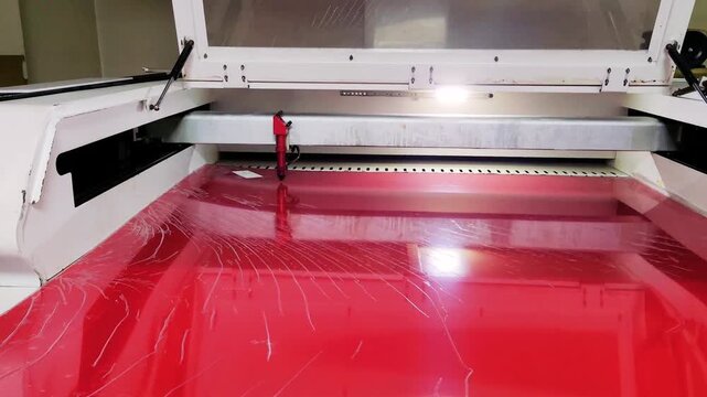 red plexiglass cut on a laser cutting machine