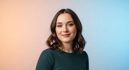 Fototapeta premium Smiling woman with brown hair in a green shirt posing for a portrait.