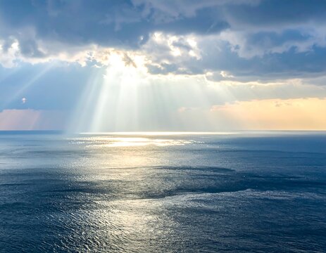 Sunbeams over a vast ocean