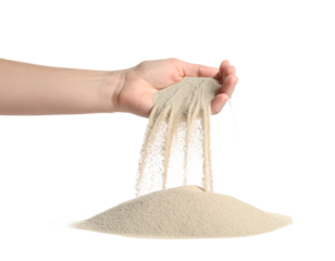 Sand pouring from hand isolated on white, time passing or loose concept.