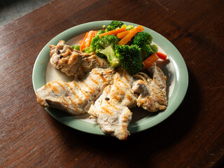 grilled chicken breast steak with broccoli and carrot