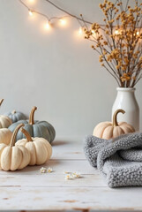 Cozy autumn still life with pumpkins, flowers, and a warm knitted blanket, mockup, product mockup