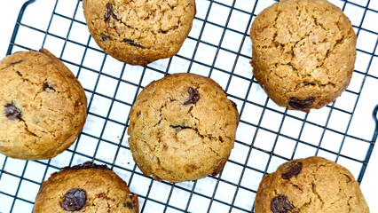 top view of delicious sweet classic cookies on wire rack on white background
