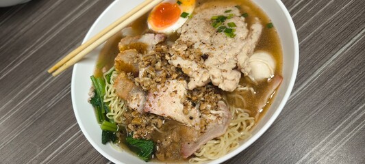 Chinese-style noodle soup on a wooden table