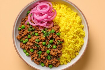 Plated beef keema with vibrant yellow rice and pickled onions, showcasing a clean minimalist composition, perfect for culinary presentations and food photography