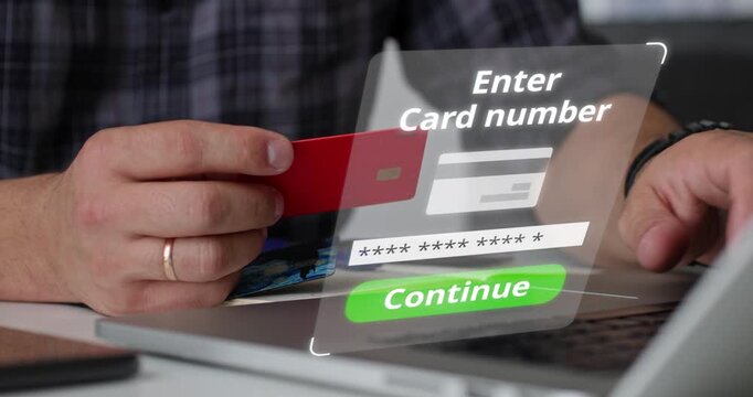 Man holding red credit card in front of laptop with digital message Payment Denied. Concept of failed transaction, banking error, or insufficient funds.