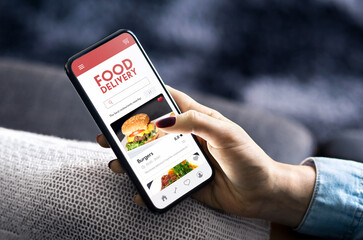 Food delivery app order in phone. Online restaurant menu. Fast take away service in mobile. Takeout burger or pizza website.Woman with smartphone in hand. Deliver lunch home.