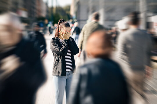 Fear, panic or anxiety of a depressed woman. Schizophrenia or stress attack. Crowd of people in street. Mental health trauma. Phobia, paranoia or agoraphobia in public. Personality disorder.