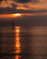 Beautiful sunset over the Mediterranean Sea in Barcelona, Spain. Golden sunlight reflects on gentle ocean waves, creating a peaceful and romantic atmosphere. Perfect for travel, nature, and landscape 