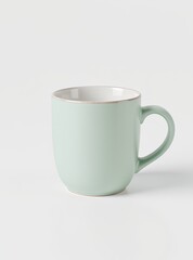 Obraz premium Minimalist pastel green ceramic mug with handle on white background, isolated and simple design