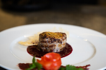 Grilled Meat Fillet with Berry Sauce and Tomato Rose