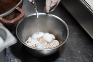 Marinated Fish Preparation in Metal Bowl