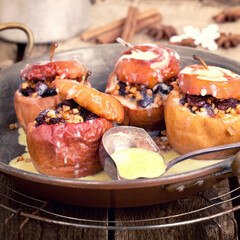 baked apple filled with nuts and almonds with delicious vanilla sauce