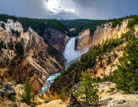 A vast waterfall cascades through a rocky canyon with a dramatic sky