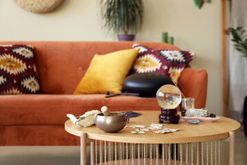 Witch's magic attributes on table in living room, closeup