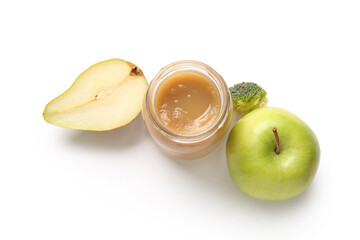 Jar of healthy baby food and ingredients on white background