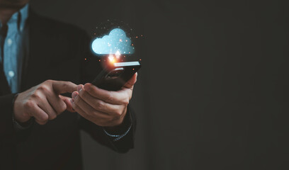 Businessman using smartphone with cloud computing icon and data upload download concept symbol of digital technology innovation online storage and modern business connection in smart network