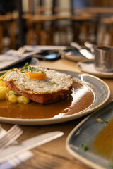 Close-up of Ham and Egg Dish in Berlin, Traditional German Cuisine