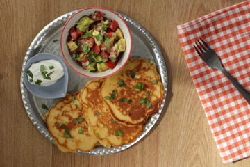 corn pancakes with salsa and sour cream
