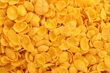 Corn flakes background texture close up. Top view cornflake cereal box for morning breakfast