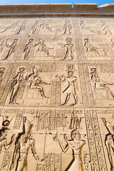 Vertical view of one of the high walls around the famous Edfu temple, Egypt, dedicated to the got Horus. Wall full of hieroglyphics.